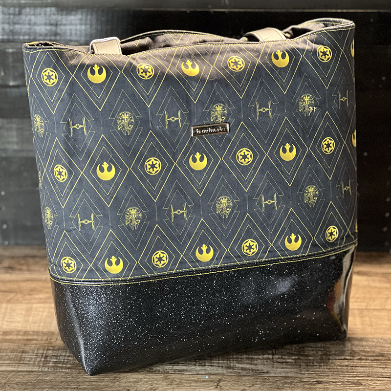 handmade tote bag with an art deco design of space ships and glitter vinyl