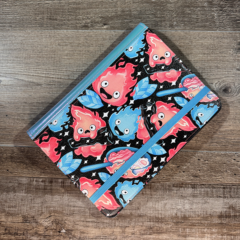 notepad holder featuring anthropomorphic flames