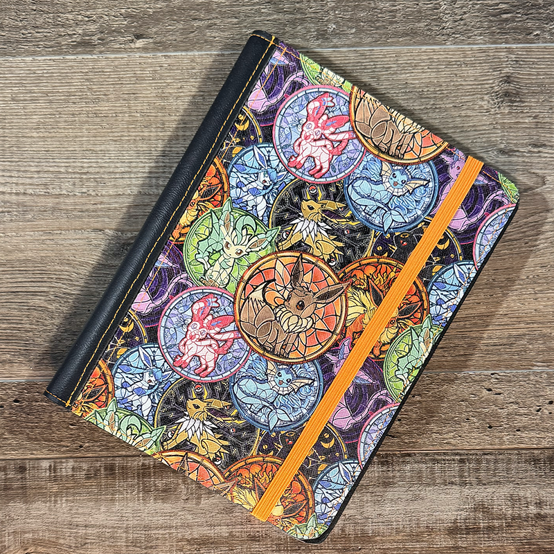 notepad holder featuring pocket monsters in pink and purple