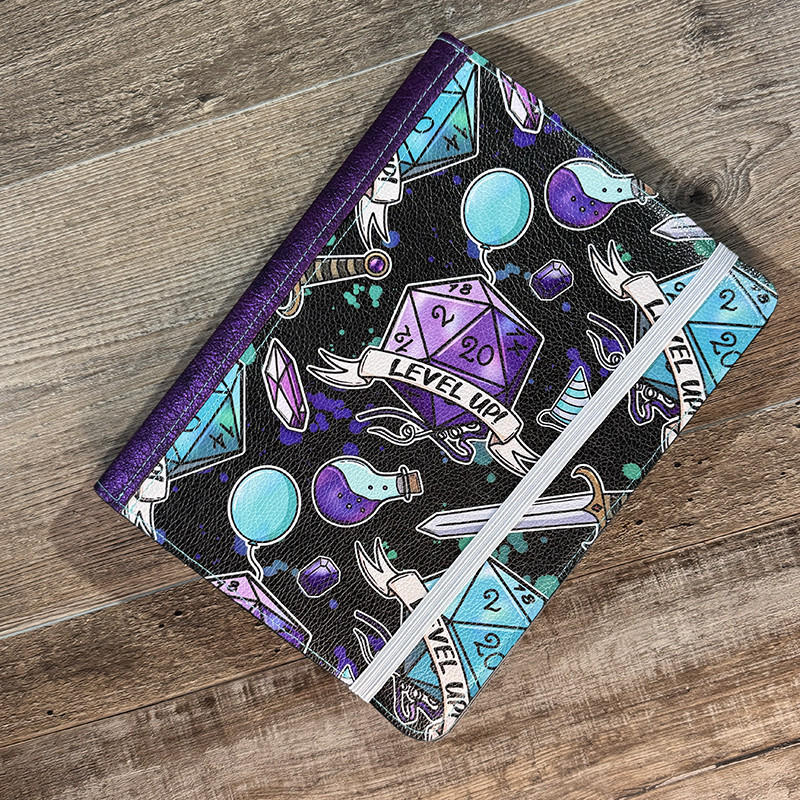 notepad holder featuring 20 sided dice and swords