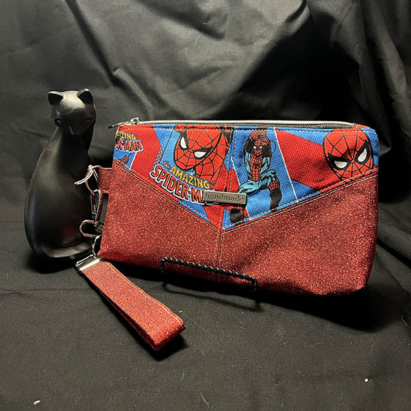 handmade zipper pouch with glitter fabric and comic book character fabric