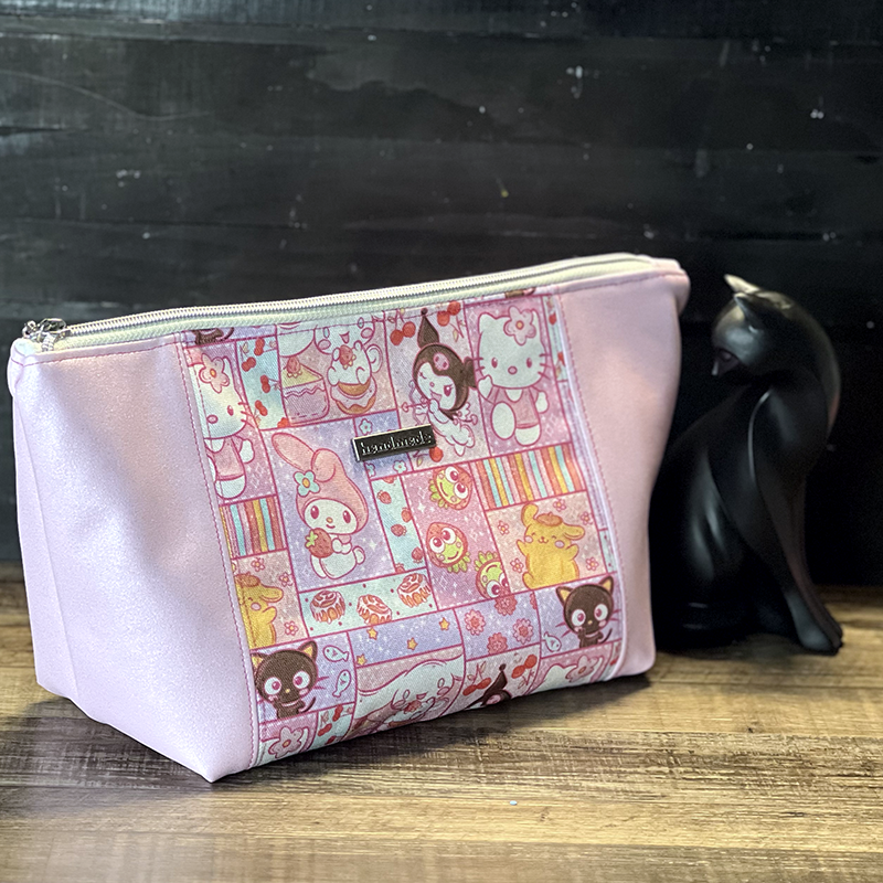 handmade cosmetics bag with pink vinyl and a cute cats design
