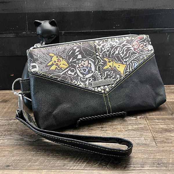 handmade zipper pouch with black vinyl and vinyl with a black and colorful paisley design