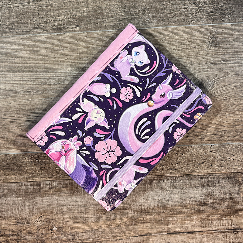 notepad holder featuring pocket monsters in pink and purple