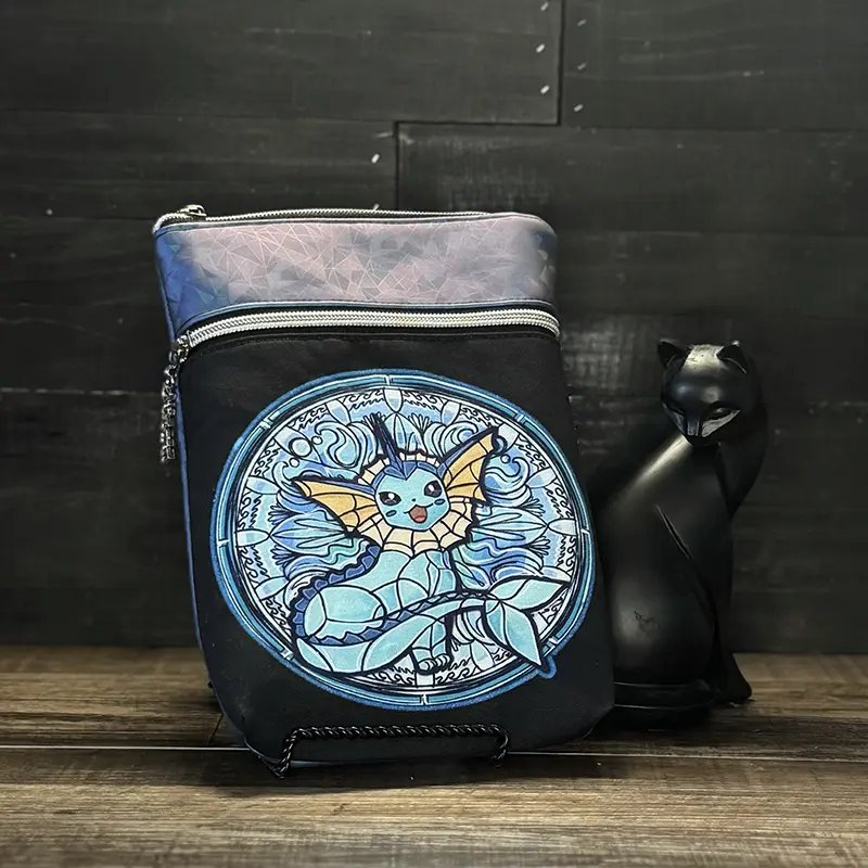 small crossbody phone bag with a wolf design in blue