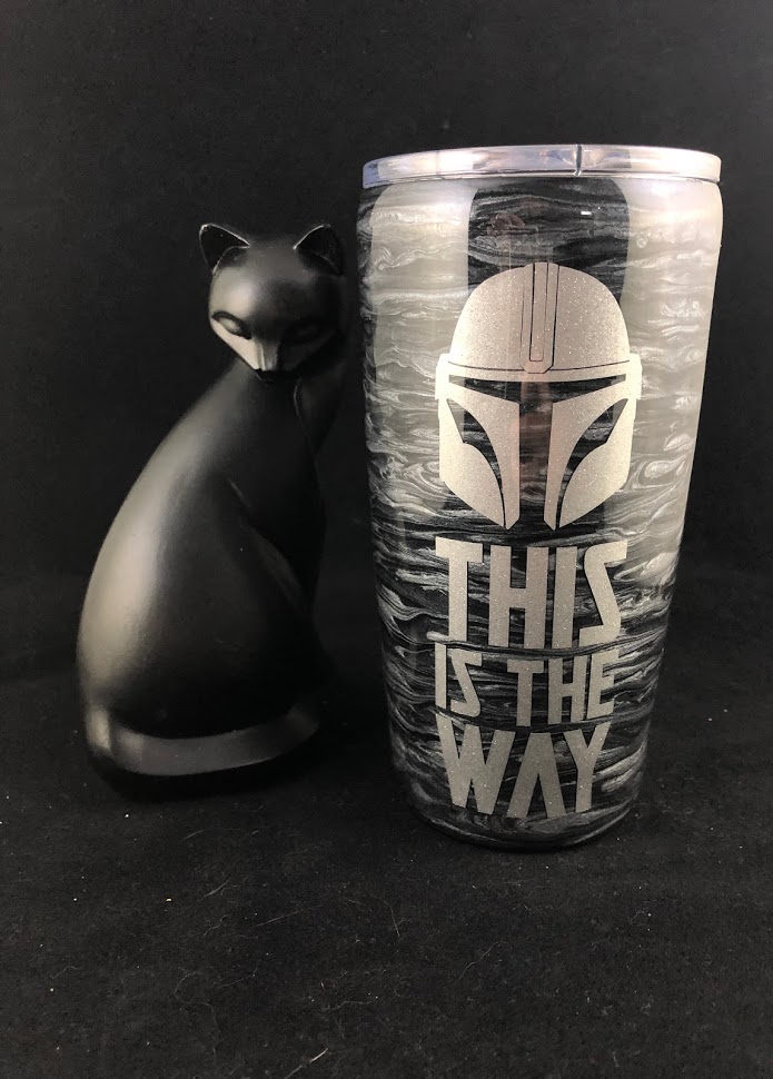 black and silver marbled cup with a helmet vinyl design and 'this is the way' text'